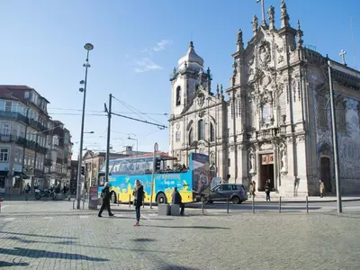 a bus is parked in front of a building at Merc Porto Central Place in Porto