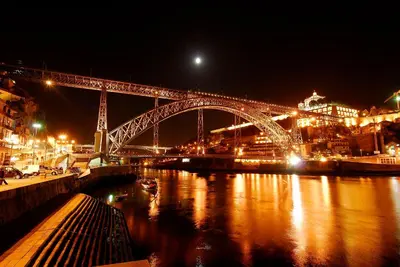 a large bridge over a river at night at Welcome to My City 