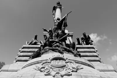 a statue of people on the top of a building at Welcome to My City 