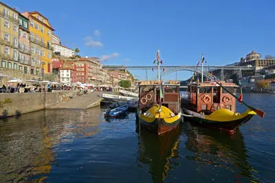 two boats are docked in the water next to buildings at Welcome to My City 