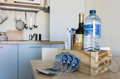 a bottle of water sitting on top of a table at Santa Catarina Cozy Nest - Porto Downtown in Porto