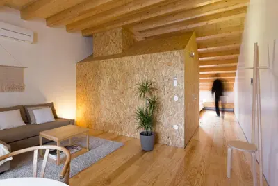 a living room with a couch and a table at Casa da Figueiroa in Porto