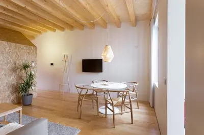 a dining room with a table and chairs at Casa da Figueiroa in Porto
