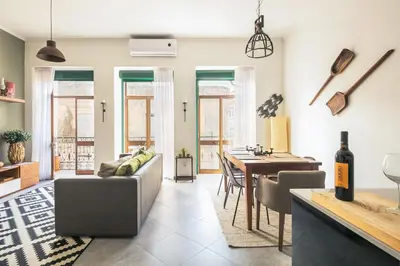 a living room with a couch and a table at Merc Porto Ribeira`s Place in Porto