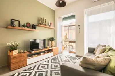 a living room with a couch and a tv at Merc Porto Ribeira`s Place in Porto
