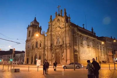 an old church with people walking in front of it at Merc Porto Ribeira`s Place in Porto