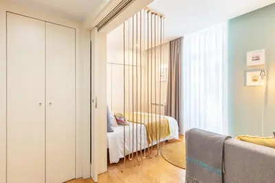 a bedroom with a bed and a mirror at D&S - Ribeira Premium Apartments in Porto