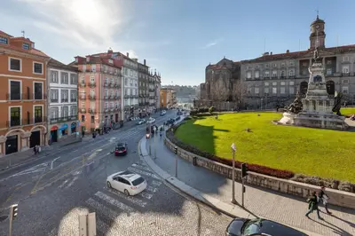 a city street with a white car parked on the street at D&S - Ribeira Premium Apartments in Porto