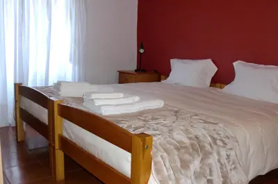 a bedroom with a bed with white towels on it at Mira Porto House in Vila Nova de Gaia