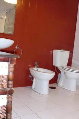 a bathroom with two toilets and a sink at Mira Porto House in Vila Nova de Gaia