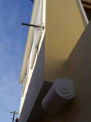 a white building with a toilet on the side of it at Apartamento Boavista in Vila Nova de Gaia