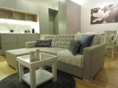a living room with a couch and a table at Cozy Flat Porto Downtown in Porto