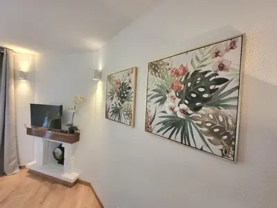 a room with three pictures on the wall at Vale Formoso Apartment in Porto