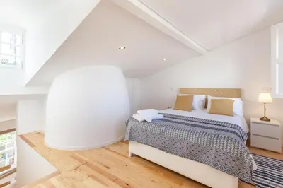 a white bedroom with a bed and a white ceiling at Sendme2Portugal: Loureiro in Porto