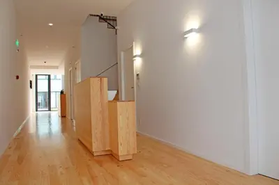 an empty room with a staircase and a white wall at Boavista Class Inn in Porto