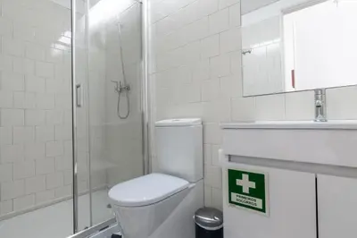 a bathroom with a shower and a toilet and a sink at Studio Sta in Porto