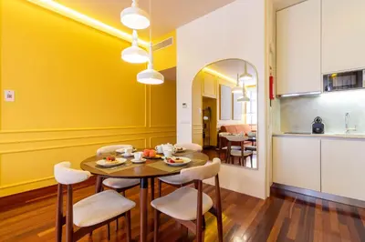 a large white building with red doors and windows at Myo Design House by LovelyStay in Porto