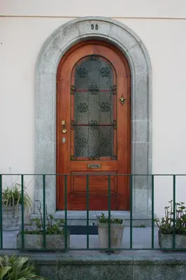 a wooden door on the side of a building at Bom dia Porto in Vila Nova de Gaia