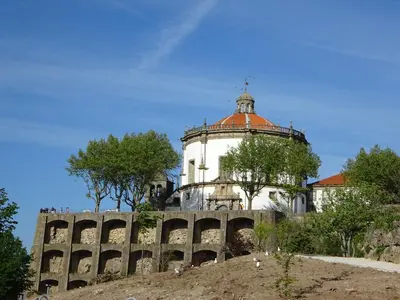 a building with a tower on top of a hill at Bom dia Porto in Vila Nova de Gaia