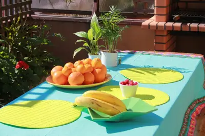 a blue table with two plates of fruit on it at Cozy Apartment with Terrace, Air Cond, Free Parking, by Porto with Love LDA in Porto