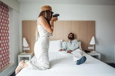 a woman standing on a bed next to a man at Stay Hotel Porto Centro Trindade in Porto