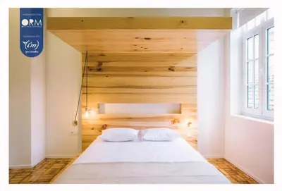 a living room with a couch and a tv and a table at ORM - Saraiva de Carvalho Apartments in Porto