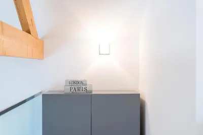a sign on top of a blue cabinet in a room at LovelyStay-Modern Loft City Center in Porto