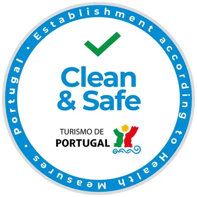 a blue clean and safe logo at Flores Lofts in Porto