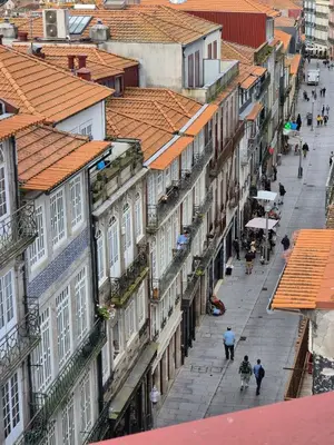 an overhead view of a city street with buildings at Flores Lofts in Porto
