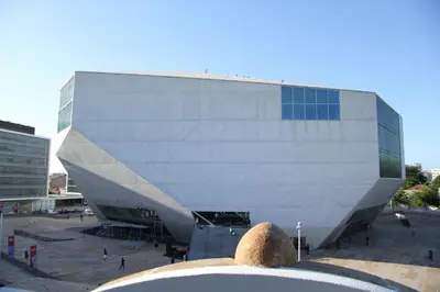 a large white building with a large building at Porto Music Guest House in Porto