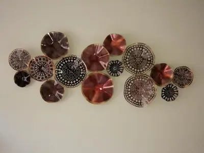 a bunch of chocolates hanging on a wall at Pontocom Bolhão Apartment in Porto
