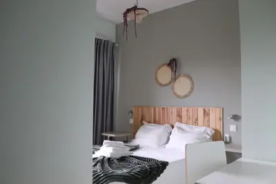 a bedroom with a bed with a zebra blanket on it at Mirandesa Garden in Porto
