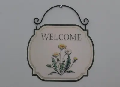 a sign with the words welcome on a wall at Mirandesa Garden in Porto
