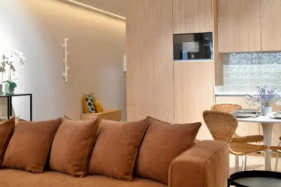 a living room with a couch and a table at Oporto Coliseum Residence in Porto