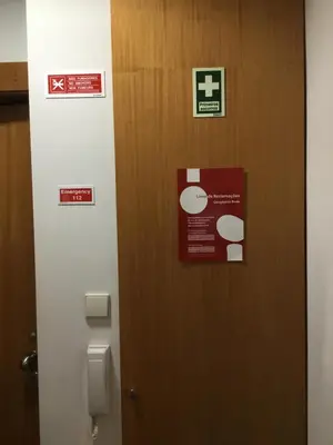 a door in a bathroom with a sign on it at Seculo apartments in Porto