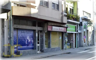 a group of shops on the side of a street at Country Apartment by JC in Porto