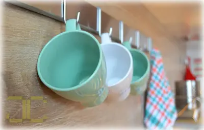 a row of green cups hanging on a wall at Country Apartment by JC in Porto