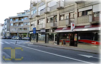 a city street with a building on the side of the road at Country Apartment by JC in Porto