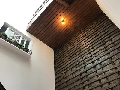 a white bathroom with a sink and a mirror at The Brewmaster's House in Porto