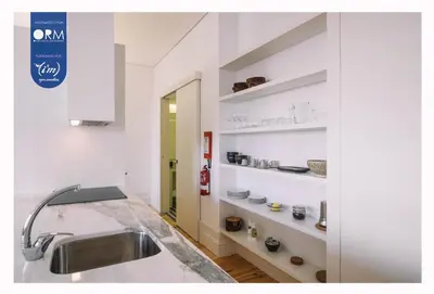 a kitchen with a sink and some shelves at ORM - Cativo Apartments in Porto