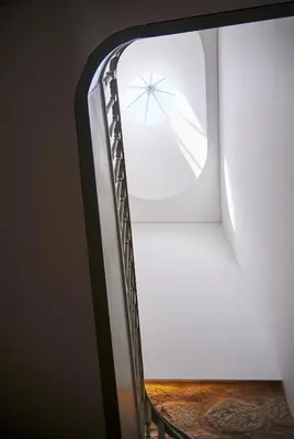 a room with a window and a wooden table at Pause Apartments in Porto