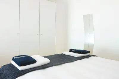 a bedroom with two towels on a bed at Lovely Mezzanine in Porto with FREE PARKING in Porto
