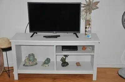 a white entertainment center with a television on top at KOKAS Apartments in Porto