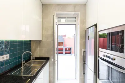 a mirror in the middle of a room with windows at Best House Center - with Garage in Porto
