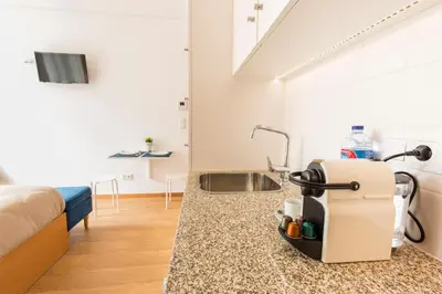 a kitchen counter with a sink in a room at Porto 271 Mouzinho Apartamentos in Porto