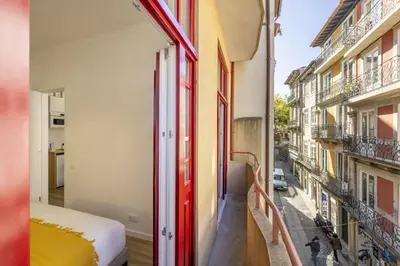 a view from a balcony of a room with a bed at D&S - Loureiro 67 in Porto