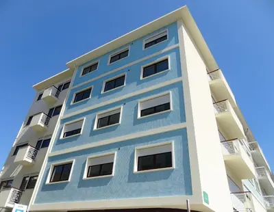a tall building with blue paint on it at RS Porto Apartments in Porto