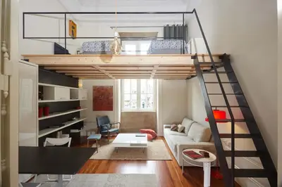 a room with a loft bed and a living room at The Passenger Hostel in Porto
