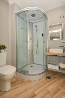 a bathroom with a shower and a toilet and a sink at Oporto Bernardes Studios - Heroísmo in Porto