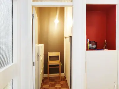 a small hallway with a chair in a room at E36 - ideal for families - large areas in Porto